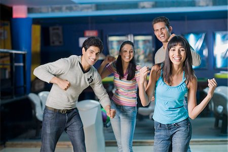 simsearch:630-03481611,k - Two young couples in a bowling alley Stock Photo - Premium Royalty-Free, Code: 630-03481601