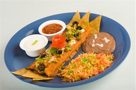 simsearch:656-04926646,k - Enchilada served on a plate Foto de stock - Sin royalties Premium, Código: 630-03481724