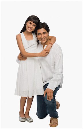 simsearch:6126-08636742,k - Man and his daughter smiling Stock Photo - Premium Royalty-Free, Code: 630-03481953