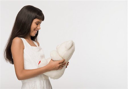 simsearch:630-03481224,k - Nahaufnahme eines Mädchens hält einen Teddybär Stockbilder - Premium RF Lizenzfrei, Bildnummer: 630-03481979