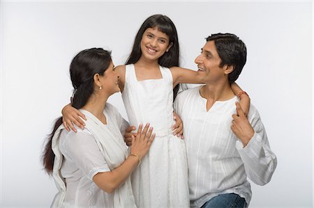 Parents smiling with their daughter Stock Photo - Premium Royalty-Free, Code: 630-03481984