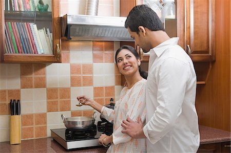 Couple cooking in the kitchen Foto de stock - Sin royalties Premium, Código: 630-03482600