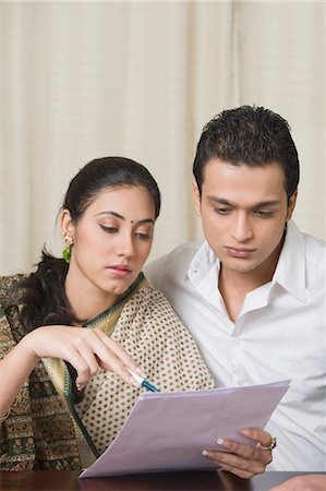 Couple preparing home budget Stock Photo - Premium Royalty-Free, Code: 630-03482645