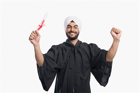 University student holding his graduation diploma Foto de stock - Royalty Free Premium, Número: 630-03482759