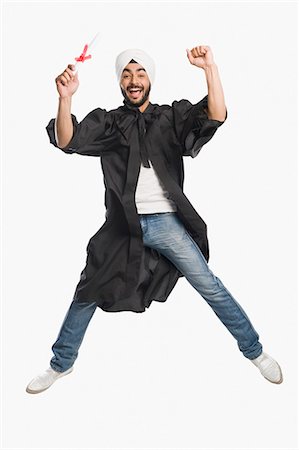 smiling student india - University student jumping with his graduation diploma Stock Photo - Premium Royalty-Free, Code: 630-03482760