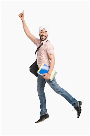 picture of indian college students - University student holding a book and smiling Stock Photo - Premium Royalty-Free, Code: 630-03482762