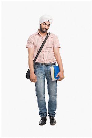 failed student - University student holding a book and looking sad Stock Photo - Premium Royalty-Free, Code: 630-03482763