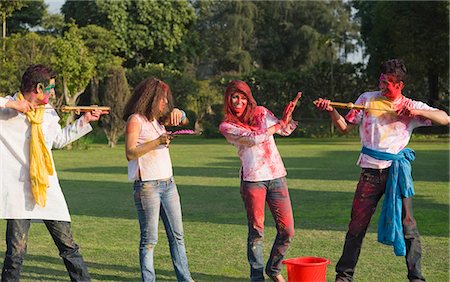 friends and buckets - Friends celebrating Holi Stock Photo - Premium Royalty-Free, Code: 630-03482960