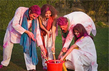 friends and buckets - Friends celebrating Holi Stock Photo - Premium Royalty-Free, Code: 630-03483005