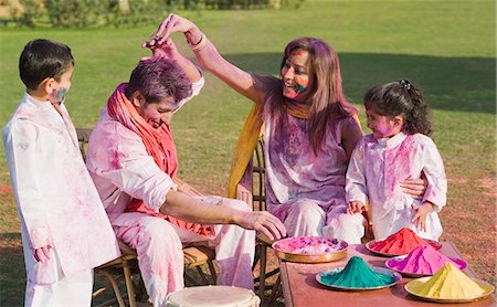 Family celebrating Holi with colors Stock Photo - Premium Royalty-Free, Code: 630-03483017