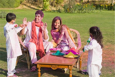 sunny festival - Family celebrating Holi with colors Stock Photo - Premium Royalty-Free, Code: 630-03483022