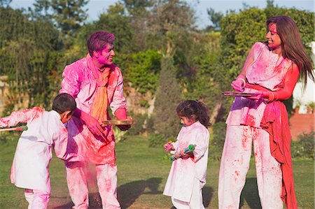 father son adult india - Family celebrating Holi with colors Stock Photo - Premium Royalty-Free, Code: 630-03483052