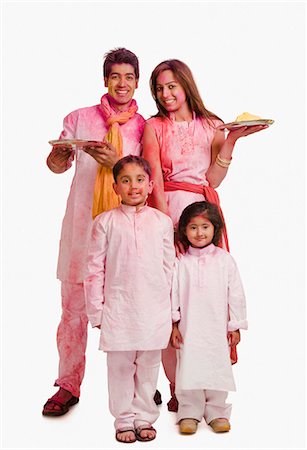Couple celebrating Holi with their children Stock Photo - Premium Royalty-Free, Code: 630-03483128