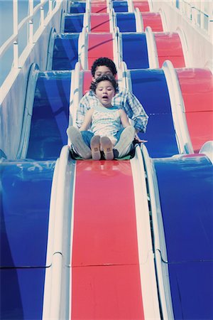 ride (amusement ride) - Children on slide, low angle view Stock Photo - Premium Royalty-Free, Code: 632-05400993