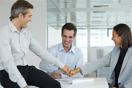 executives working together - Colleagues fist bumping Stock Photo - Premium Royalty-Free, Code: 632-05401122