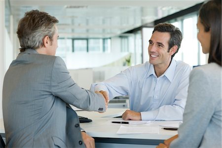 Businessman shaking hands with client Stock Photo - Premium Royalty-Free, Code: 632-05401285