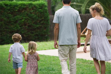people walking rear view - Family walking together outdoors, rear view Stock Photo - Premium Royalty-Free, Code: 632-05554003