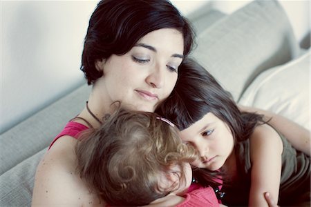 Mother and daughters embracing Stock Photo - Premium Royalty-Free, Code: 632-05554146