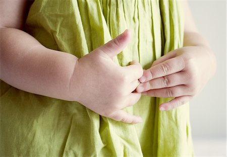 Child putting hands on stomach Stock Photo - Premium Royalty-Free, Code: 632-05554164