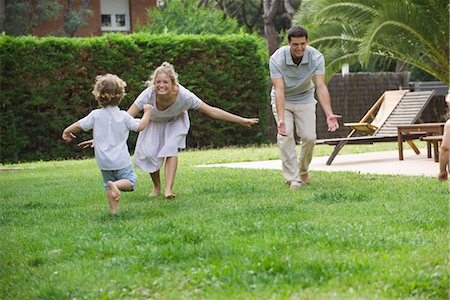 father kid run play - Family having fun together outdoors Stock Photo - Premium Royalty-Free, Code: 632-05553456
