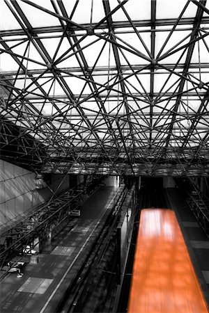 european buildings black and white - Train station, train moving on track, partial desaturation Stock Photo - Premium Royalty-Free, Code: 632-05553473