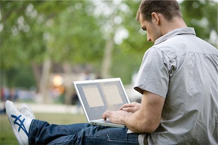 Man using laptop computer outdoors Stock Photo - Premium Royalty-Free, Code: 632-05553499