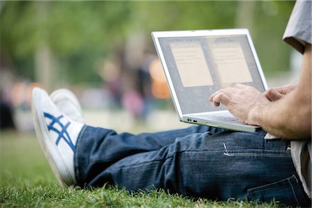 sitting on the ground with a laptop - Man using laptop computer outdoors Stock Photo - Premium Royalty-Free, Code: 632-05553670