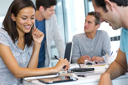 people looking at tablet in office - Colleagues working together with digital tablet in office Stock Photo - Premium Royalty-Free, Code: 632-05553703