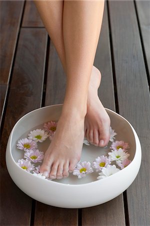 feet with flower - Woman enjoying relaxing foot bath Stock Photo - Premium Royalty-Free, Code: 632-05553731