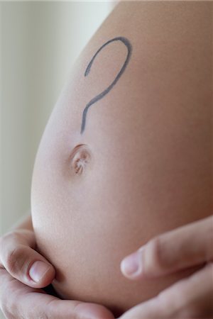 question mark symbol - Question mark drawn on woman's pregnant belly Foto de stock - Sin royalties Premium, Código: 632-05553785