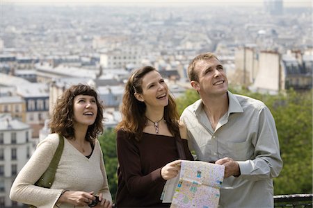 friends vacation map - Tourists standing with map, looking up, Paris, France Stock Photo - Premium Royalty-Free, Code: 632-05553838