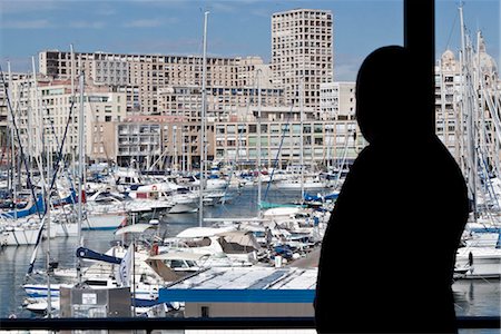 port yacht - Silhouette of person looking at view of harbor Stock Photo - Premium Royalty-Free, Code: 632-05553866