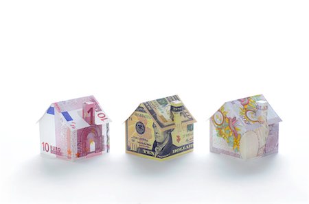 simsearch:632-06317333,k - Model houses folded with different currencies Stock Photo - Premium Royalty-Free, Code: 632-05553890