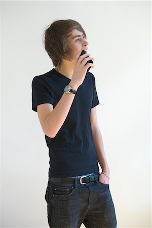 Young man talking on cell phone Stock Photo - Premium Royalty-Free, Code: 632-05553935