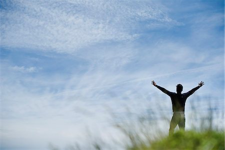 freedom and one adult - Man with arms up in nature, rear view Stock Photo - Premium Royalty-Free, Code: 632-05604019