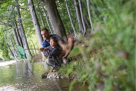 parents river - Father and son caught fish in fishing net Stock Photo - Premium Royalty-Free, Code: 632-05604070