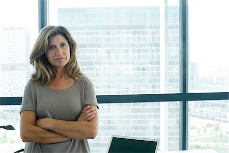 Businesswoman with arms folded Stock Photo - Premium Royalty-Free, Code: 632-05604081