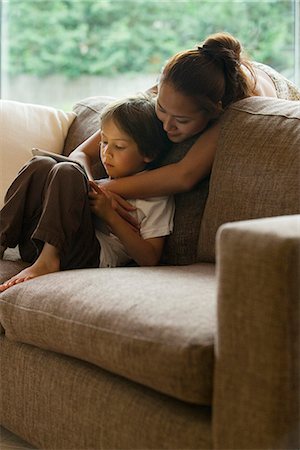 ebook - Mother and son looking at digital tablet together Stock Photo - Premium Royalty-Free, Code: 632-05604097