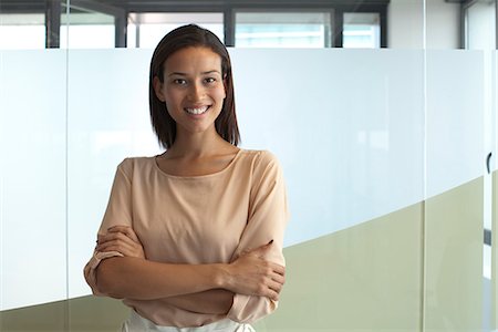 simsearch:632-05604394,k - Smiling woman in office, portrait Stock Photo - Premium Royalty-Free, Code: 632-05604147