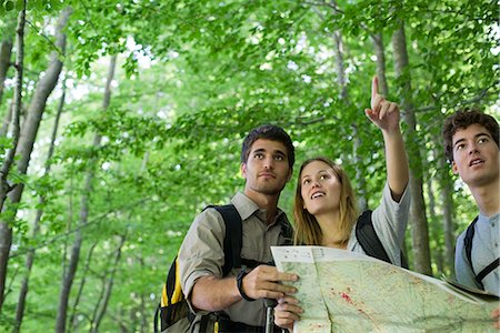 focus on foreground forest - Hikers consulting map Stock Photo - Premium Royalty-Free, Code: 632-05604170