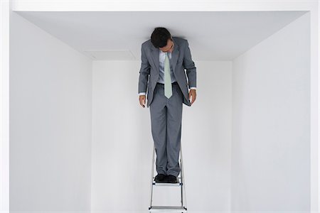 simsearch:700-03553427,k - Executive standing on stepladder Stock Photo - Premium Royalty-Free, Code: 632-05604172