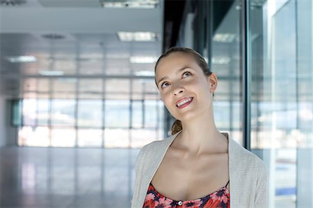 Woman looking up with head tilted Stock Photo - Premium Royalty-Free, Code: 632-05604195