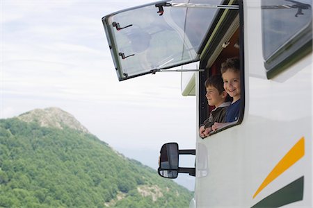 Young boys looking out motor home window Stock Photo - Premium Royalty-Free, Code: 632-05604217