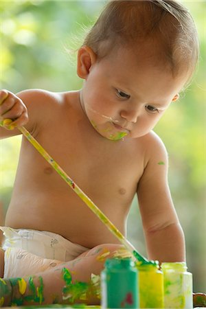 paint messy - Baby playing with paintbrush and paint Stock Photo - Premium Royalty-Free, Code: 632-05604210