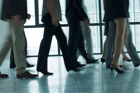 feet walking men - Silhouette of people walking in corridor Stock Photo - Premium Royalty-Free, Code: 632-05604254