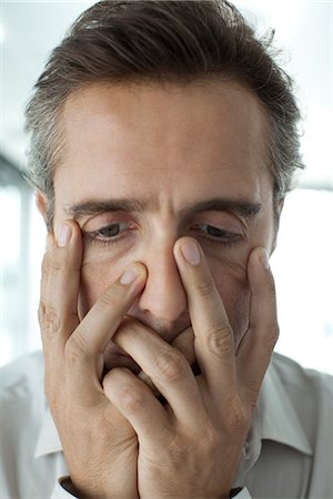 desperate - Man with hands covering face Stock Photo - Premium Royalty-Free, Code: 632-05604272