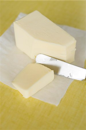 Cutting butter Stock Photo - Premium Royalty-Free, Code: 632-05604335