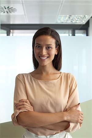 simsearch:632-05604394,k - Smiling woman in office, portrait Stock Photo - Premium Royalty-Free, Code: 632-05604445