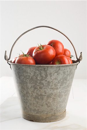 Fresh tomatoes in bucket Stock Photo - Premium Royalty-Free, Code: 632-05604460