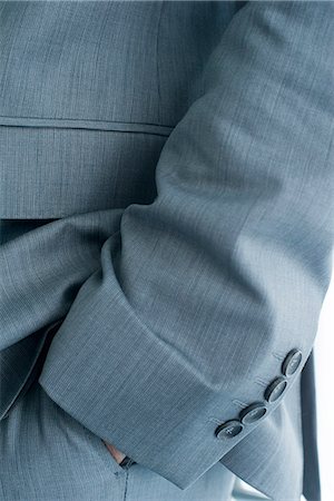 fabric button - Executive with hand in pocket, cropped Stock Photo - Premium Royalty-Free, Code: 632-05604499